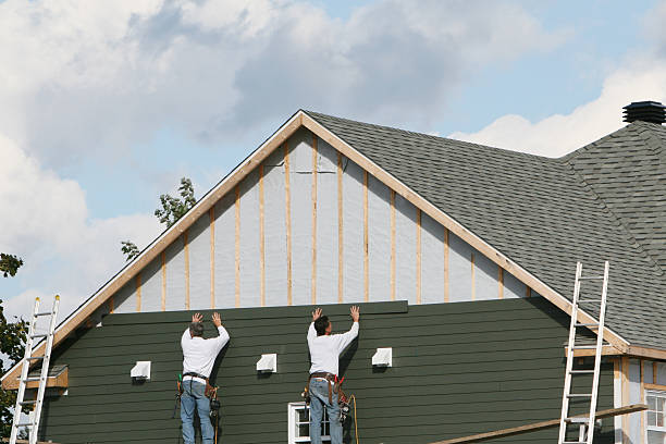 Professional Siding Installation technician working in Grassflat, PA